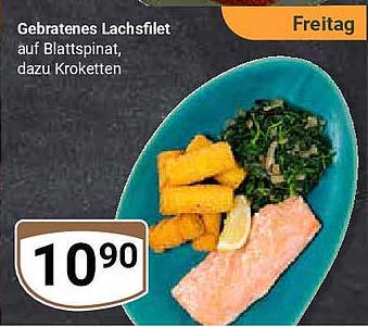 Gebratenes Lachsfilet auf Blattspinat, dazu Kroketten