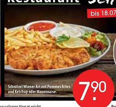 Schnitzel Wiener Art mit Pommes frites und Ketchup oder Mayonnaise.