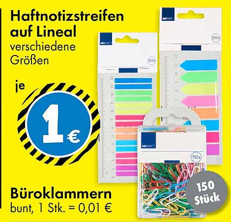 Haftnotizstreifen auf Lineal und bunte Büroklammern